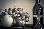 Apples And A Glass With Black And White Stock Photo