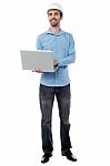 Architect Holding Laptop And Looking Upwards Stock Photo