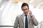 Asia Business Man Using A Mobile Phone Stock Photo