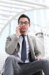 Asia Business Man Using A Mobile Phone Stock Photo