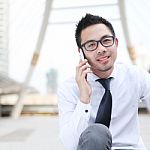 Asia Business Man Using A Mobile Phone With Copyspace Stock Photo