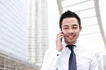 Asia Business Man Using A Mobile Phone With Copyspace Stock Photo