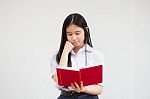 Asia Thai High School Student Uniform Beautiful Girl Read A Book Stock Photo