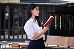 Asia Thai High School Student Uniform Beautiful Girl Read A Book Stock Photo