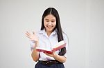 Asia Thai High School Student Uniform Beautiful Girl Read A Book Stock Photo