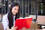 Asia Thai High School Student Uniform Beautiful Girl Read A Book Stock Photo