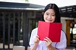 Asia Thai High School Student Uniform Beautiful Girl Read A Book Stock Photo