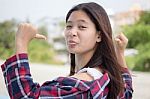 Asia Thai Teenager Women Scotch T-shirt Relax And Smile Stock Photo