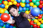 Asian Boy And Colorful Small Ball Stock Photo