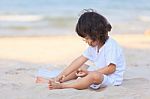 Asian Boy Play On Beach Stock Photo