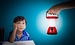 Asian Boy Thinking And Looking Up, Hand Holding Plastic Electric Stock Photo