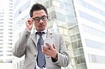 Asian Business Man Speaking Mobile Phone Stock Photo