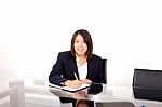 Asian Businesswoman Writing Stock Photo