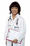 Asian Doctor Holding Clipboard Stock Photo