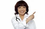 Asian Doctor Pointing Up gesture Stock Photo