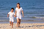 Asian Family On Beach Stock Photo