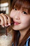 Asian Girl Drinking Ice Coffee Stock Photo