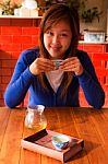 Asian Girl Drinking Tea In Morning Stock Photo