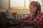 Asian Girl With A Notebook On Table Stock Photo