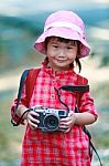 Asian Girl With Digital Camera In Beautiful Outdoor Stock Photo