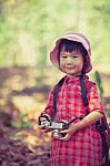 Asian Girl With Digital Camera In Beautiful Outdoor. Vintage Pic Stock Photo