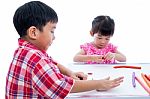 Asian Kids Playing With Play Clay On Table. Strengthen The Imagi Stock Photo