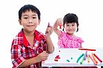 Asian Kids Playing With Play Clay On Table. Strengthen The Imagi Stock Photo