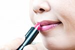 Asian Lady Applying Lipstick Stock Photo