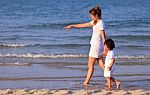 Asian Mom And Son On Beach Stock Photo