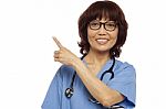 Asian Surgeon Pointing Up Gesture Stock Photo