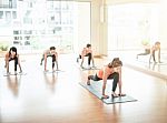 Asian Woman Doing Yoga Indoors Stock Photo