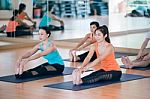 Asian Woman Doing Yoga Indoors Stock Photo