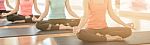 Asian Woman Doing Yoga Indoors Stock Photo