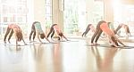 Asian Woman Doing Yoga Indoors Stock Photo