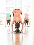 Asian Woman Doing Yoga Indoors Stock Photo