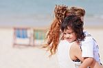 Asian Woman Holding Her Son Stock Photo