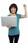 Asian Woman Holding Laptop Stock Photo