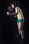 Asian Woman Playing Badminton Stock Photo