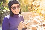 Asian Woman With Smiling Face Happiness Emotion And Smart Phone In Hand Use For People And Digital Technology Stock Photo