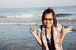 Asian Women Smiling Happily At The Beach Stock Photo