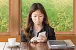 Asian Young Girl Using Mobile Phone Stock Photo