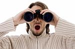 Astonished Male Watching Through Binocular Stock Photo