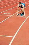 Athletic Man On Track, All Set For Race Stock Photo