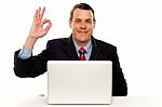 Attractive Businessperson Showing Okay Gesture Stock Photo