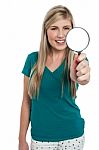 Attractive Girl Holding Magnifying Glass Stock Photo