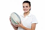 Attractive Sporty Girl Posing With Rugby Ball Stock Photo