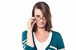 Attractive Woman Holding Her Eyeglasses Stock Photo