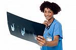 Attractive Young Medical Professional Holding X-ray Sheet Stock Photo