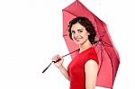 Attractive Young Woman Holding An Umbrella Stock Photo