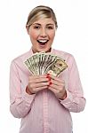 Attractive Young Woman Holding Money Stock Photo